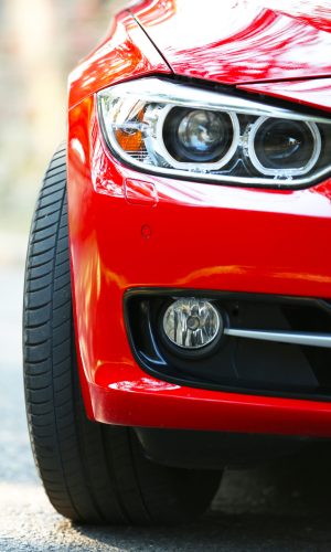 Headlights of red car